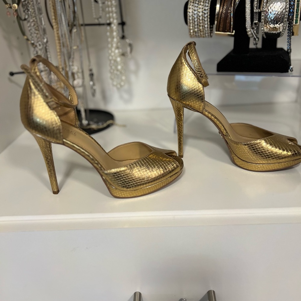 Michael Kors gold high heeled sandal. Comfortable platform shoe
